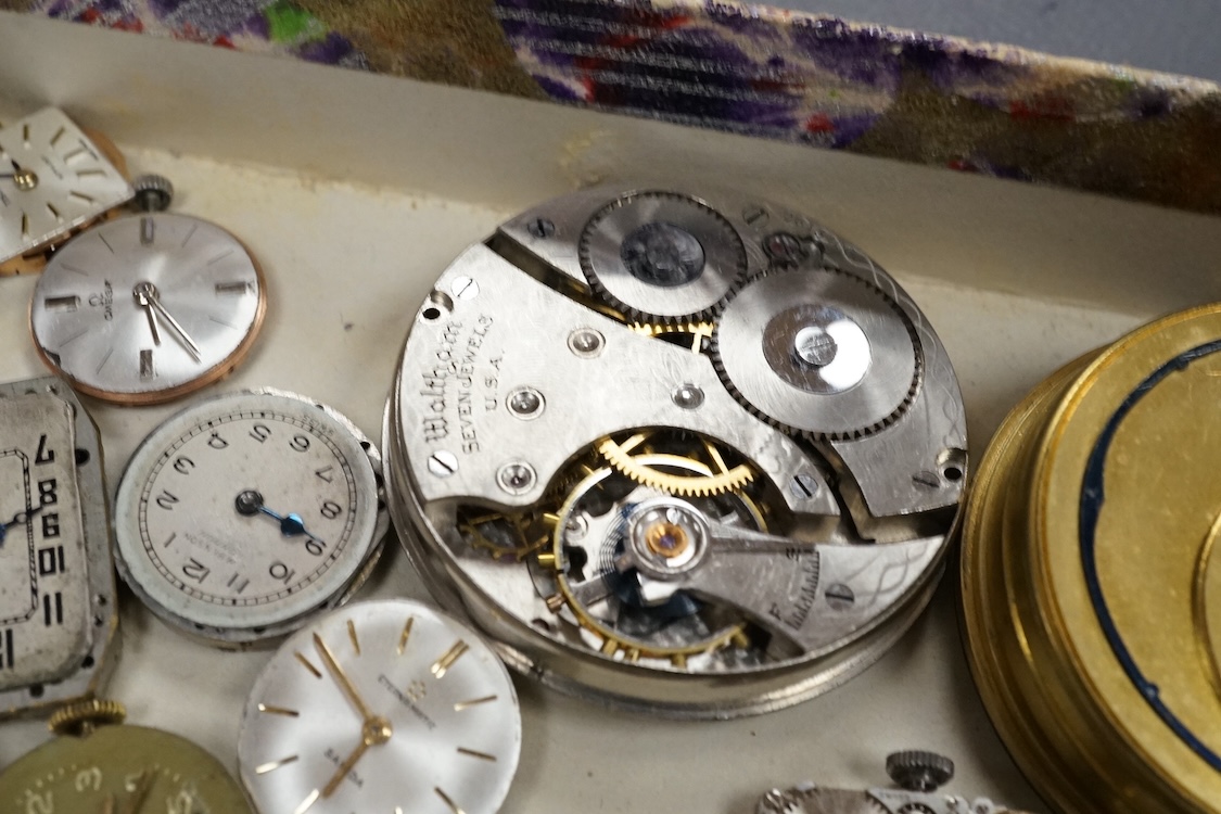 A quantity of assorted wrist and pocket watch movements, including Omega and Omega automatic, together with a pocket watch and a 935 white metal fob watch.